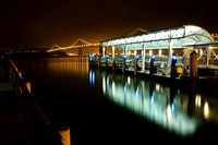 The Ferry Terminal and Bay Bridge in San Francisco, California at night